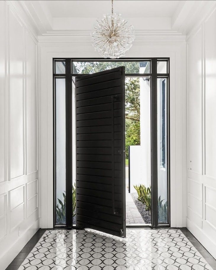 Pivot iron door — With sidelights and transom